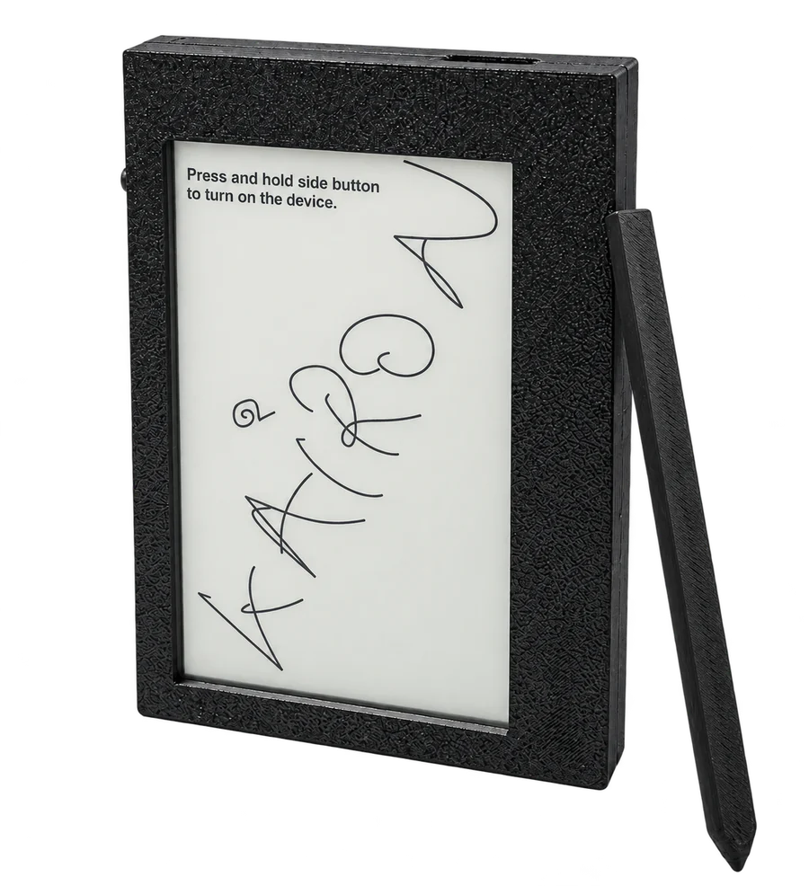 The Kairon prototype: a small black writing tablet with a 4.7 inch electronic paper screen and a stylus