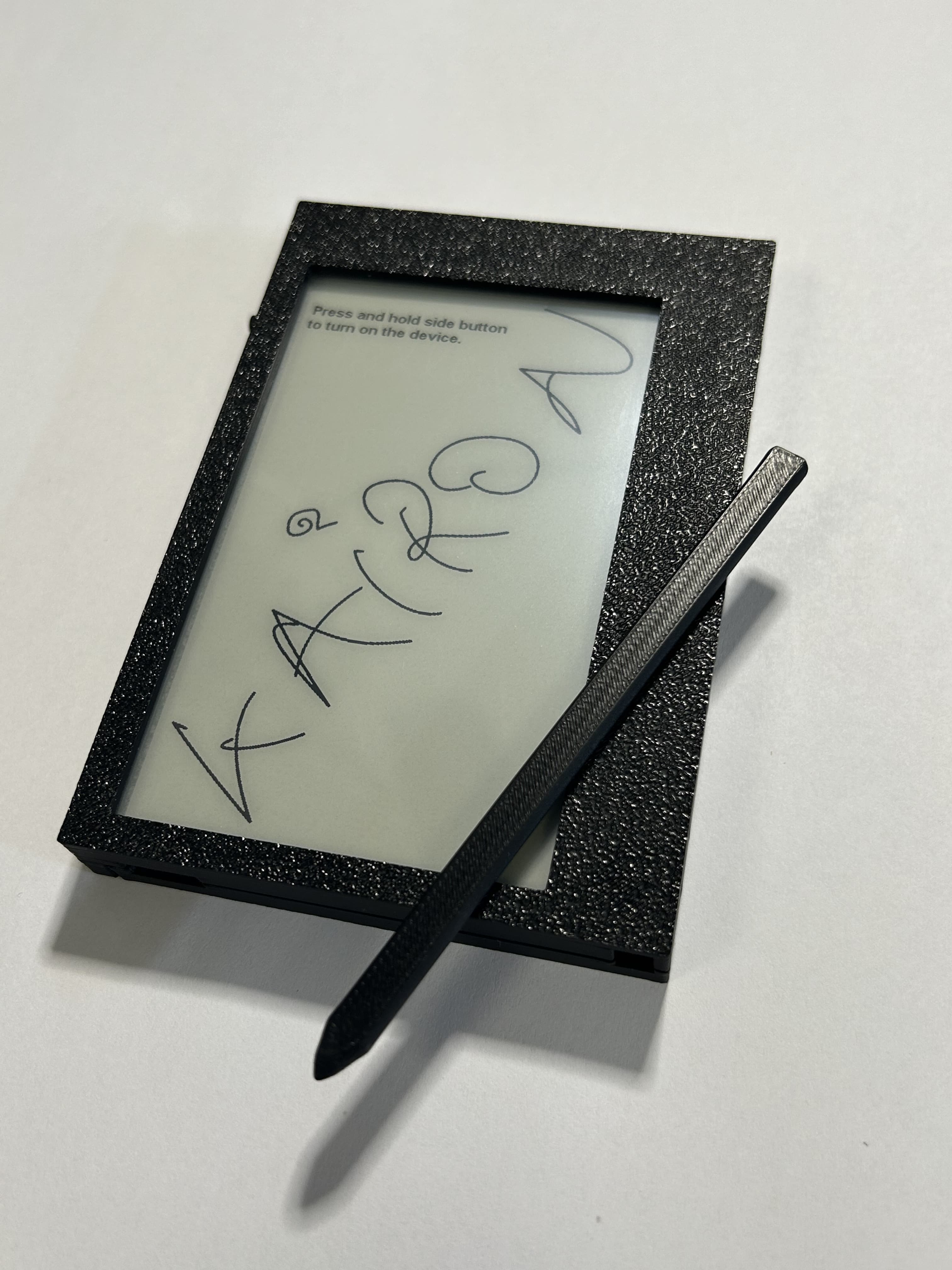 The Kairon notebook and stylus shown together