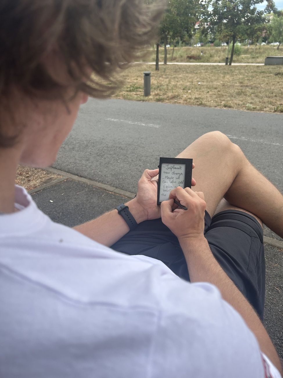 Writing on Kairon while sitting on a park bench