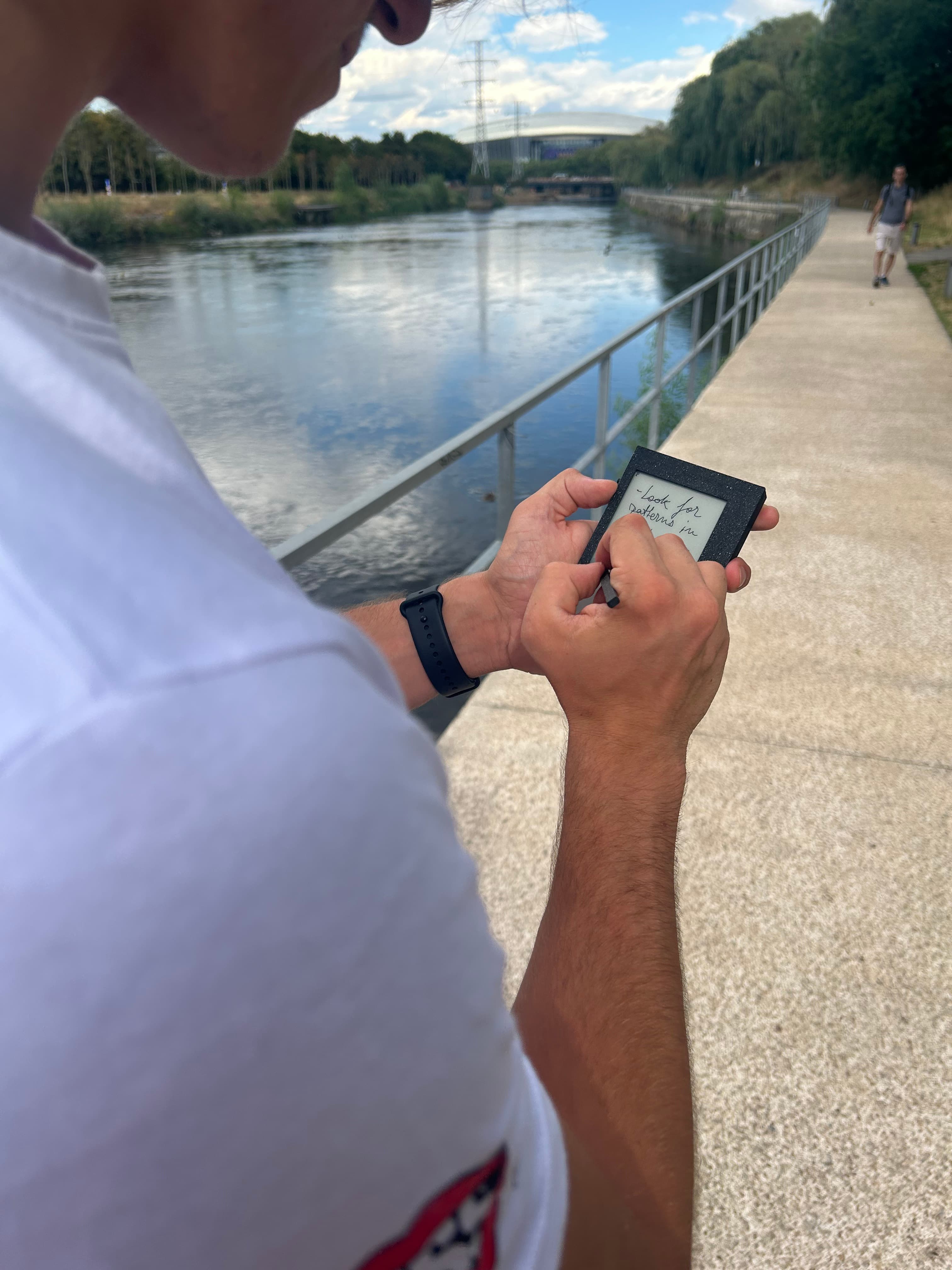 Writing a thought on Kairon while walking beside a river